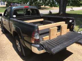 The truck bed has 2 notches on each side for 2x6's or 2x4's.